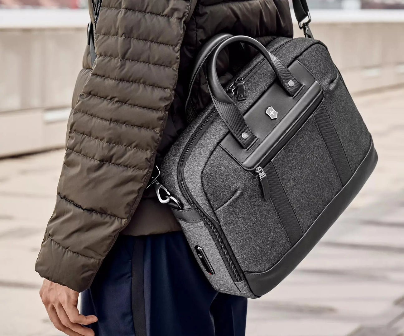 Stylish gray and black laptop bag or briefcase with leather trim and handles.