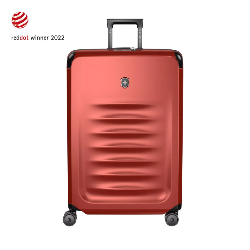 Red hardshell rolling suitcase with horizontal ridges and a retractable handle.