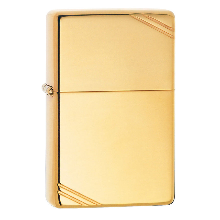Gold-colored Zippo-style metal lighter with diagonal corner accents.