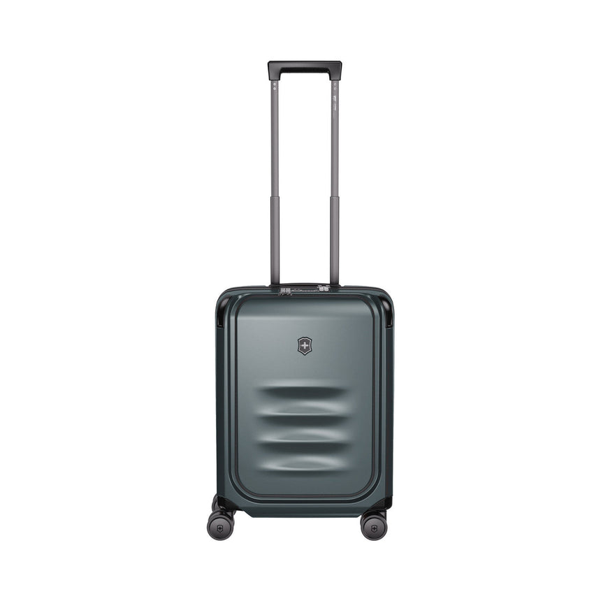Metallic gray hardshell rolling suitcase with an extendable handle and wheels.
