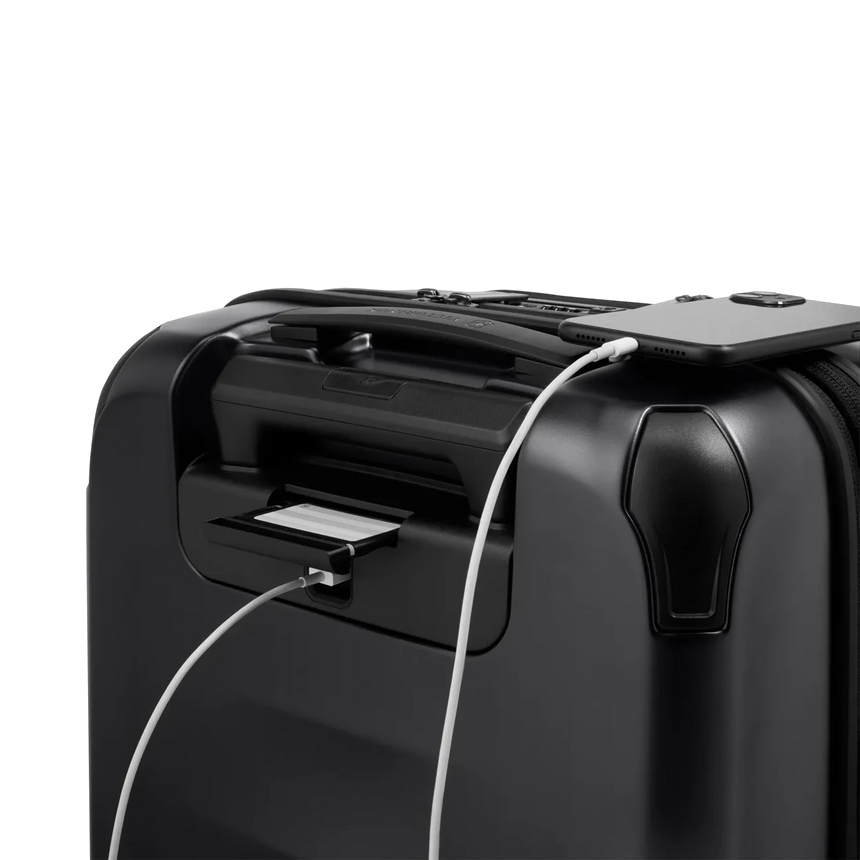 Black suitcase with a built-in USB charging port.