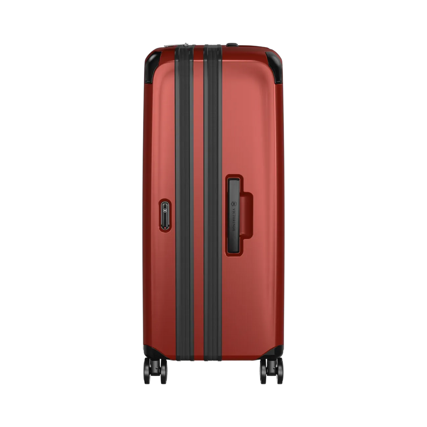 Red hardshell suitcase with black trim and wheels.