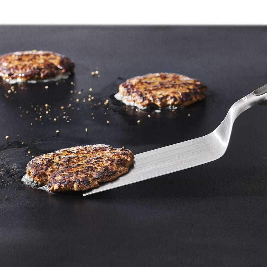 Grilled or pan-seared veggie burger patties with visible seeds and grains.