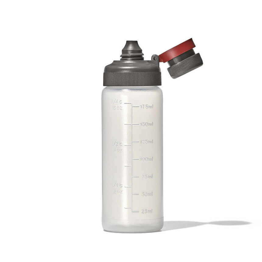 Transparent plastic water bottle with a gray cap and red flip-top spout.