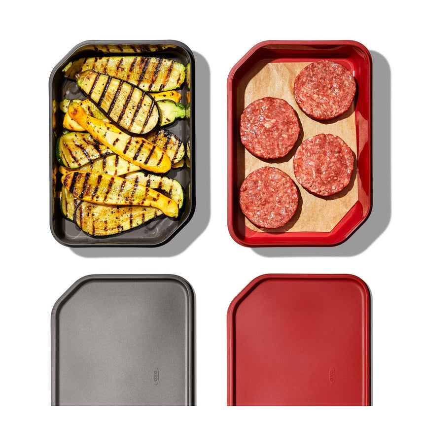 Four food containers with grilled zucchini and raw hamburger patties.