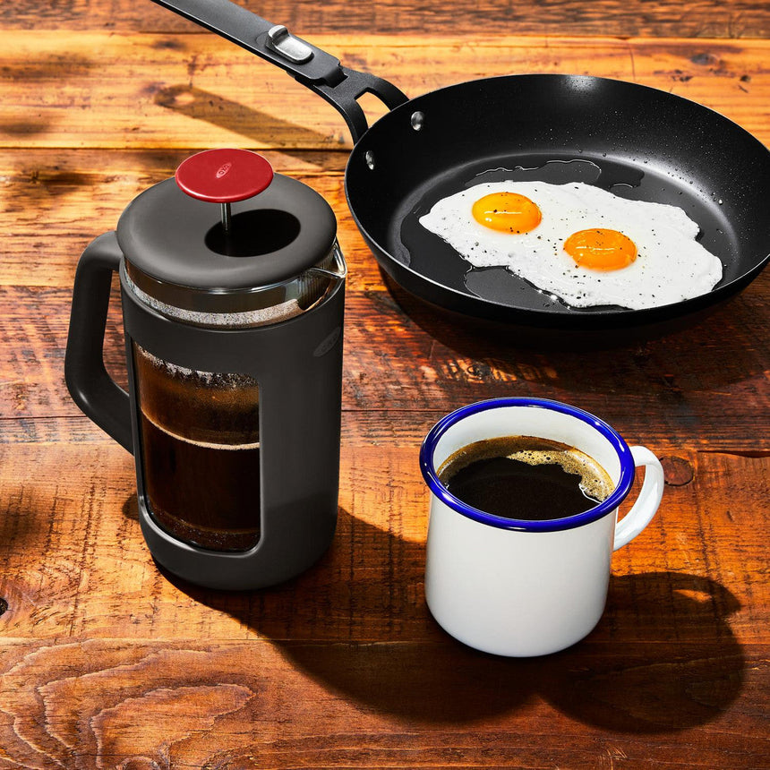 Frying pan containing two sunny-side-up eggs.