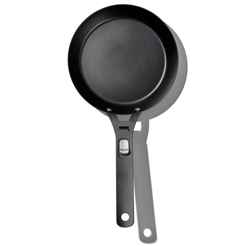 Black non-stick frying pan with a long handle.