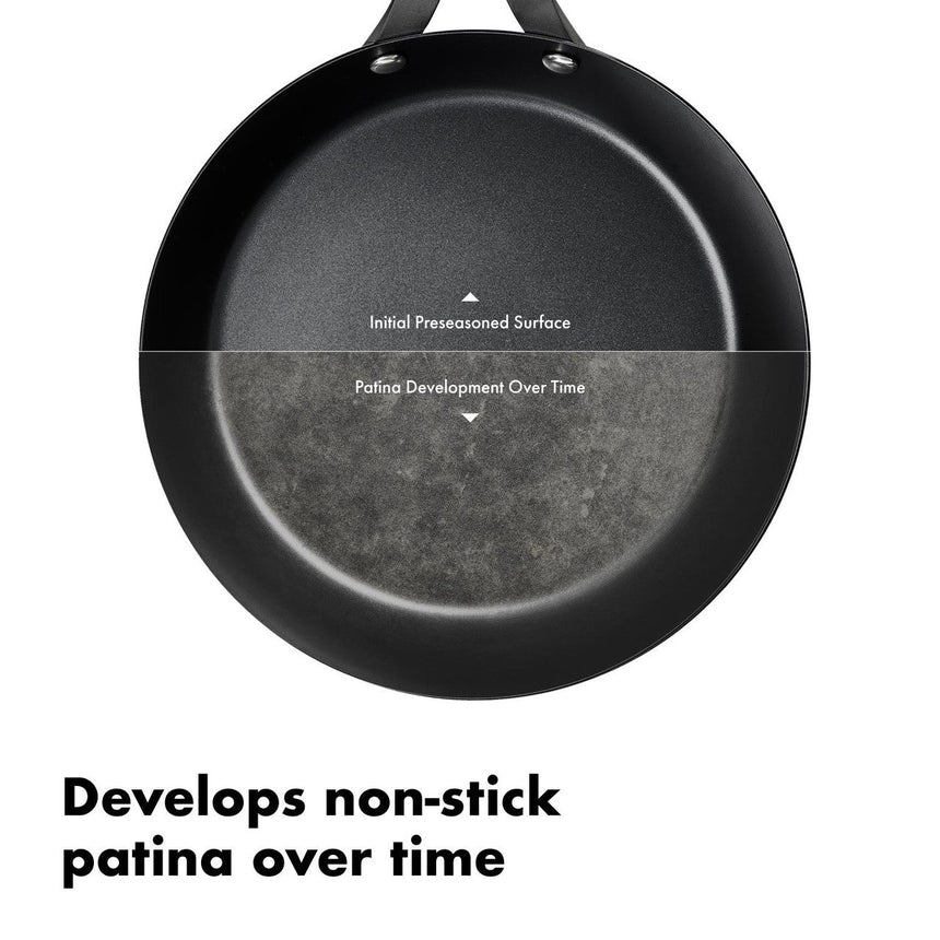 Black frying pan with a partially developed non-stick patina surface.