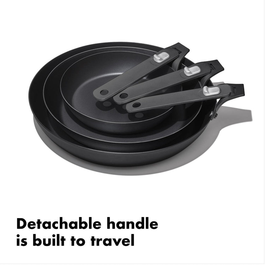 Set of three nonstick frying pans with detachable handles.