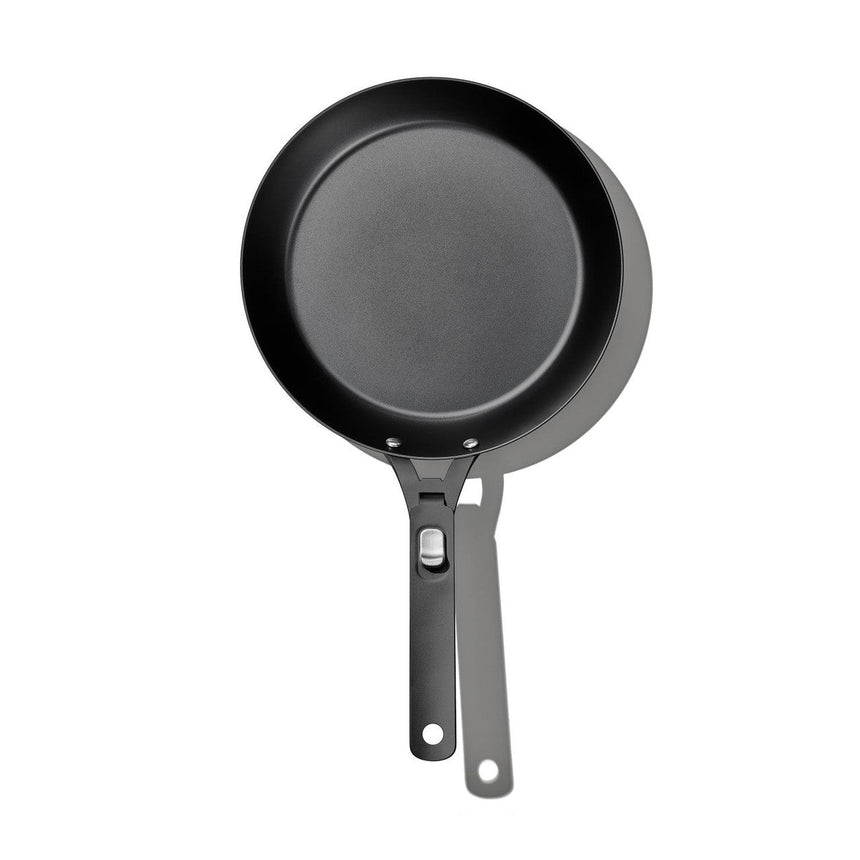 Black non-stick frying pan with a handle.