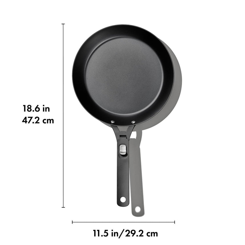 Black frying pan with a long handle.