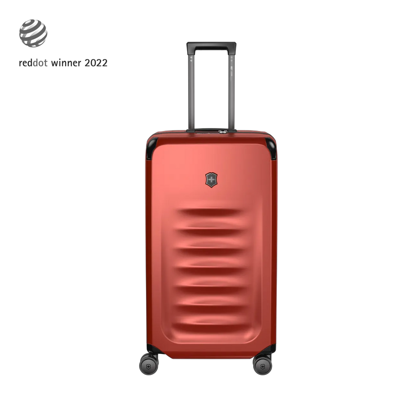 Red hardshell rolling suitcase with horizontal ridges and a retractable handle.