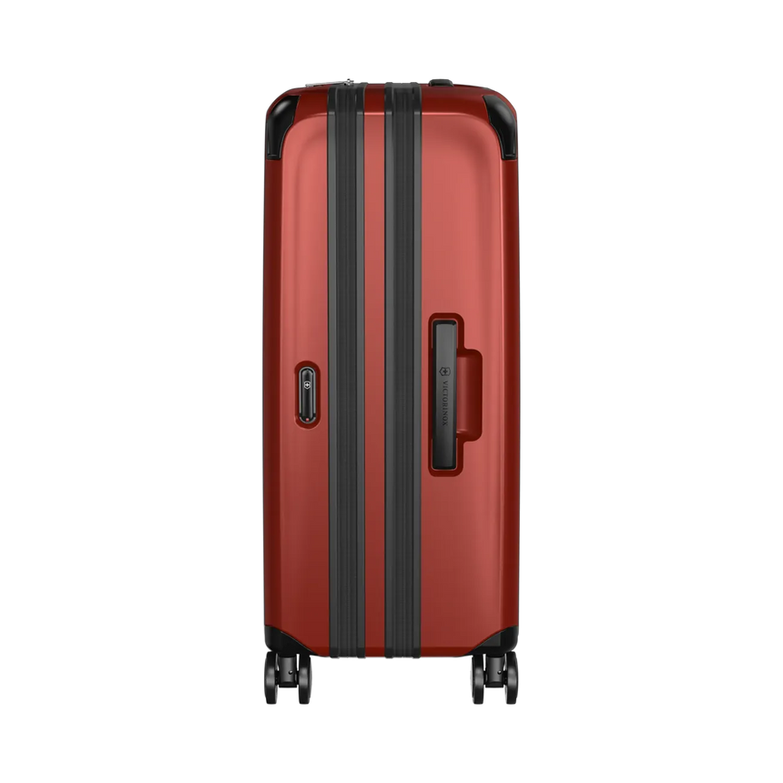 Red hardshell suitcase with black trim and wheels.