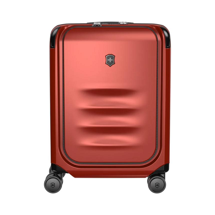 Red hardshell rolling suitcase with horizontal ridges on the front panel.