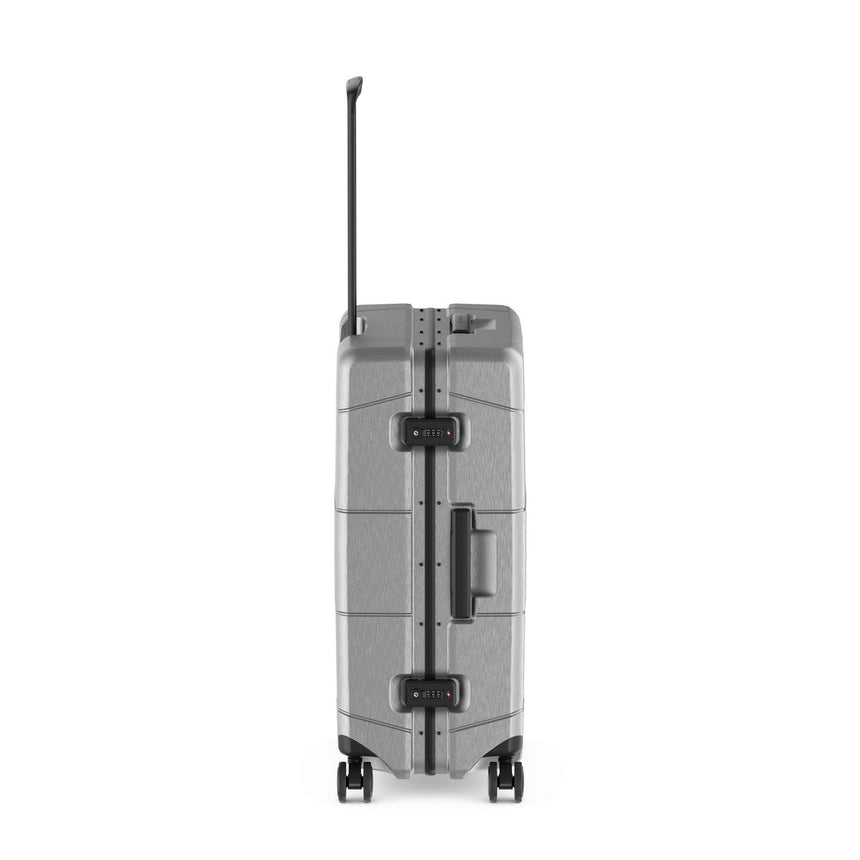 Hard-shell rolling suitcase with horizontal ridges and a telescoping handle.
