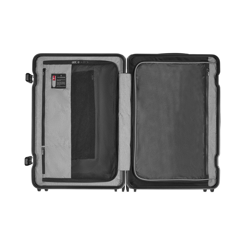 Open hard-shell suitcase with two compartments and interior pockets.