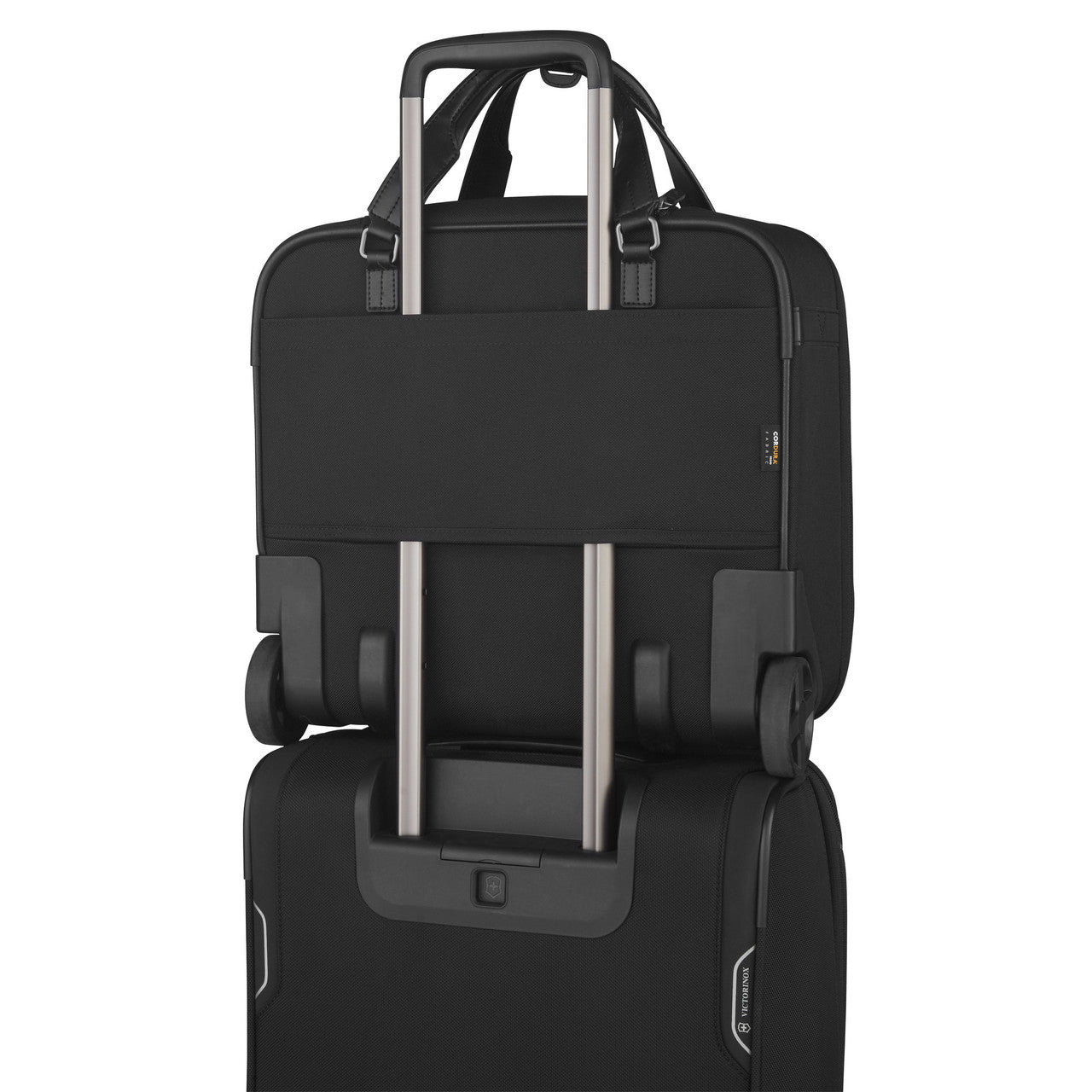 Black laptop bag with a luggage strap for attaching to rolling suitcases.