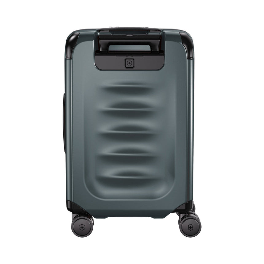 Gray hardshell rolling suitcase with horizontal ridges on the front panel.