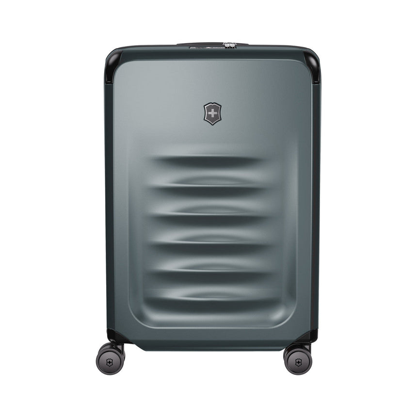 Gray hardshell rolling suitcase with horizontal ridges and a logo emblem.