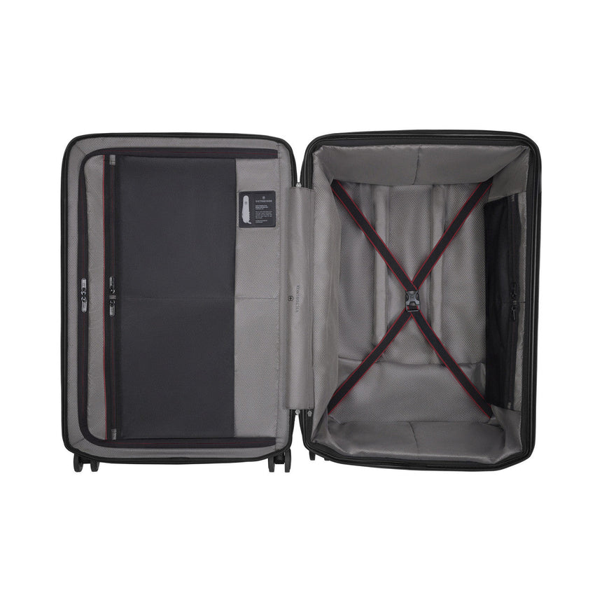 Open suitcase showing its interior compartments and straps.
