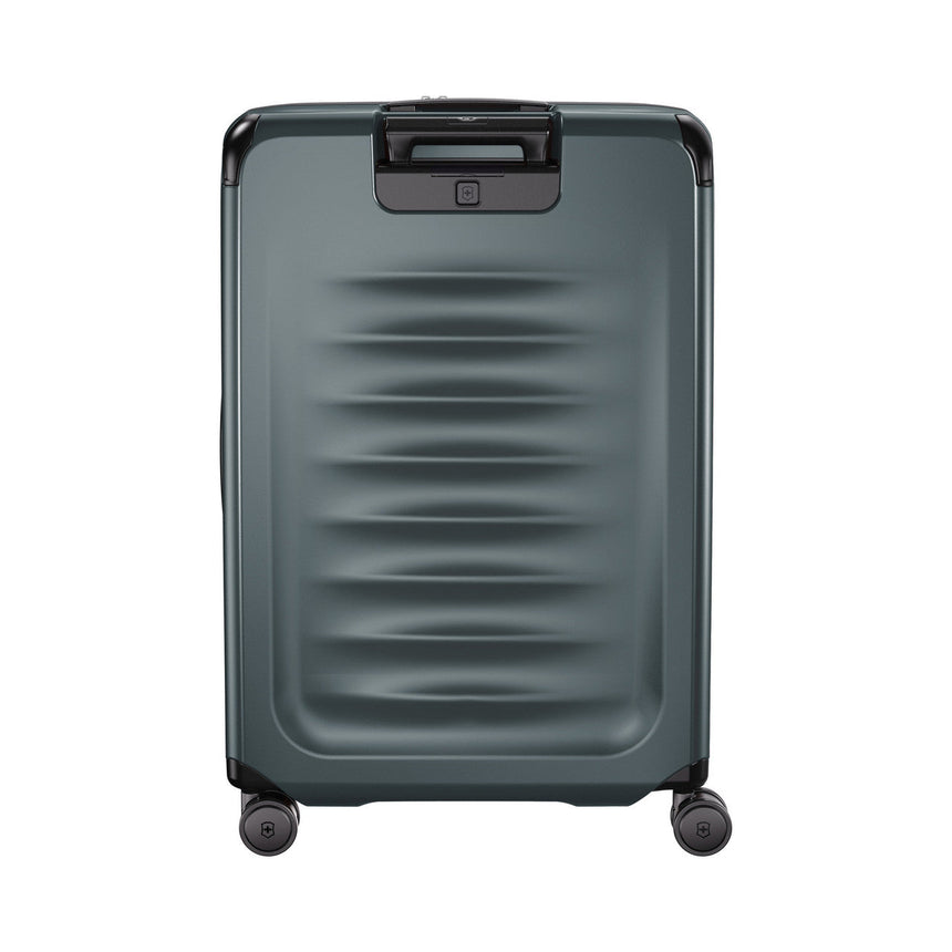 Hard-shell rolling suitcase with horizontal ridges and a retractable handle.