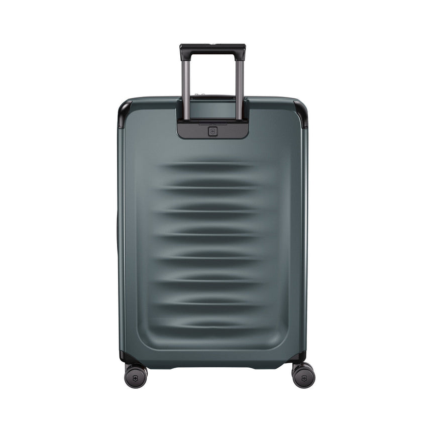 Gray hardshell rolling suitcase with a retractable handle and wheels.