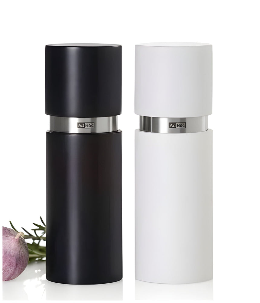 Salt and pepper grinder set in black and white.