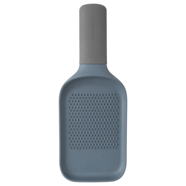 Bottle-shaped grater with a textured surface and cylindrical neck.