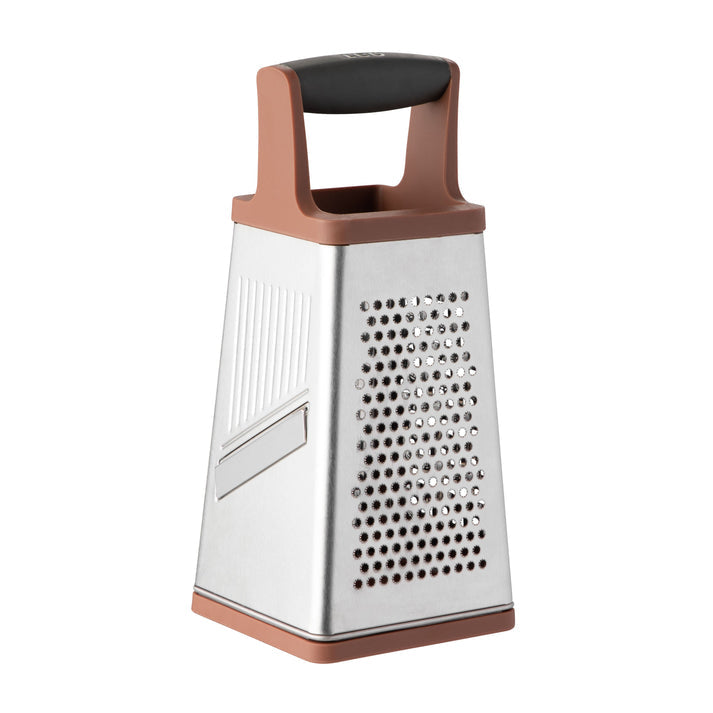 Four-sided stainless steel grater with a rose gold-colored handle and base.