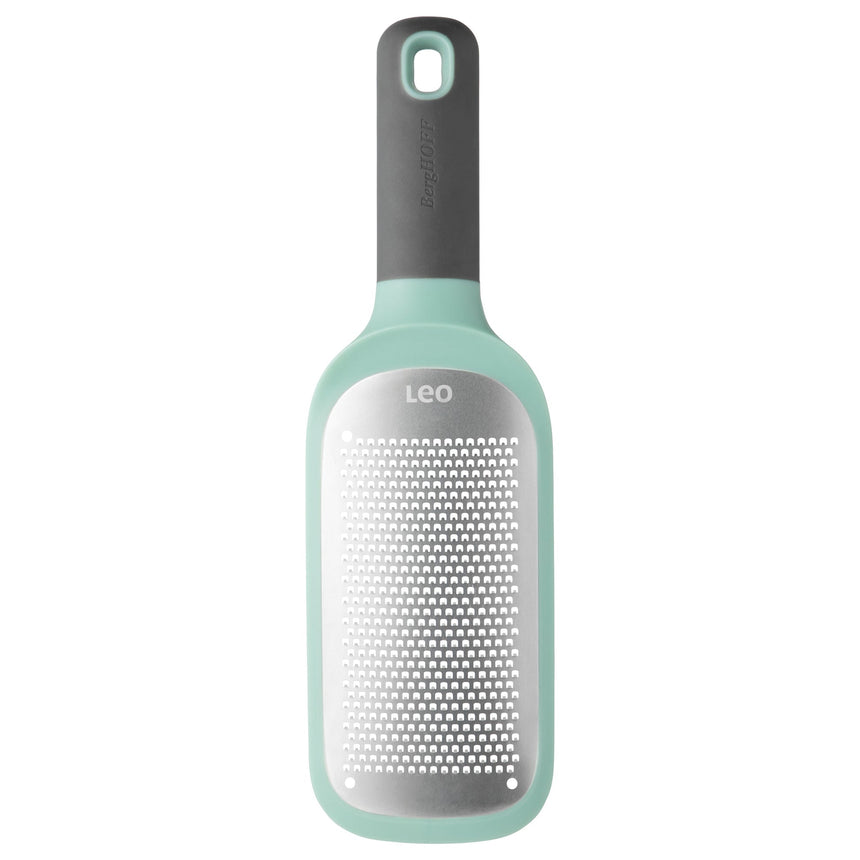 Mint green and gray handheld cheese grater with a perforated metal surface.