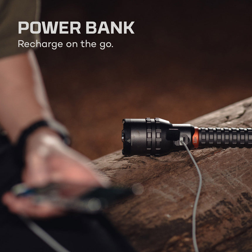 Flashlight or tactical light with a charging cable attached.