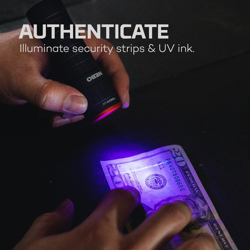 Ultraviolet light device illuminating security features on a banknote.