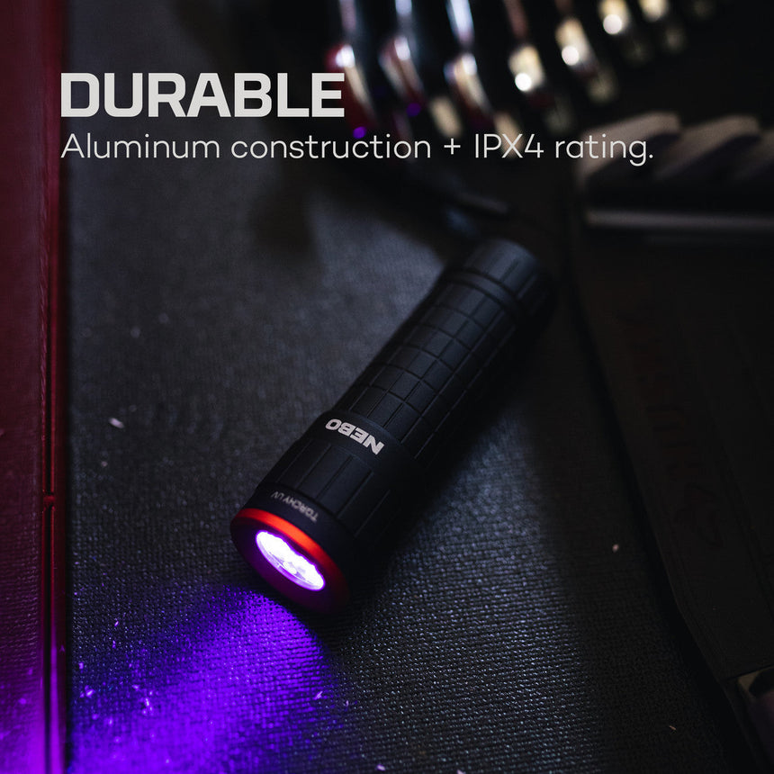 Handheld UV flashlight with aluminum construction and IPX4 water resistance rating.