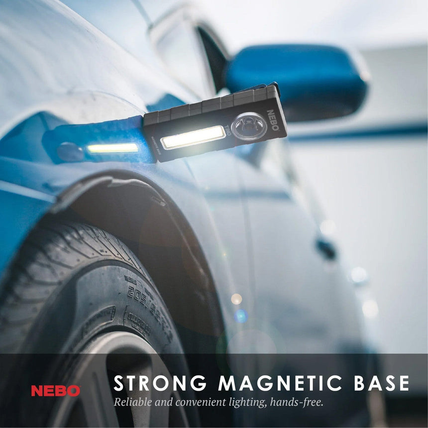 Portable LED work light with a magnetic base attached to a car’s wheel well.
