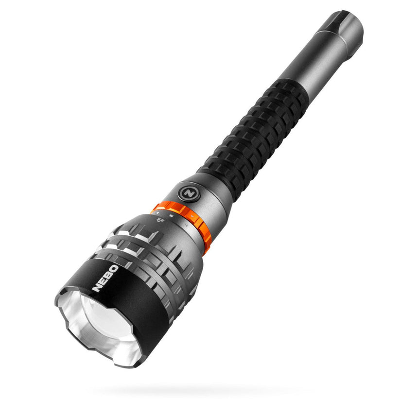Handheld flashlight with a textured grip and adjustable focus ring.