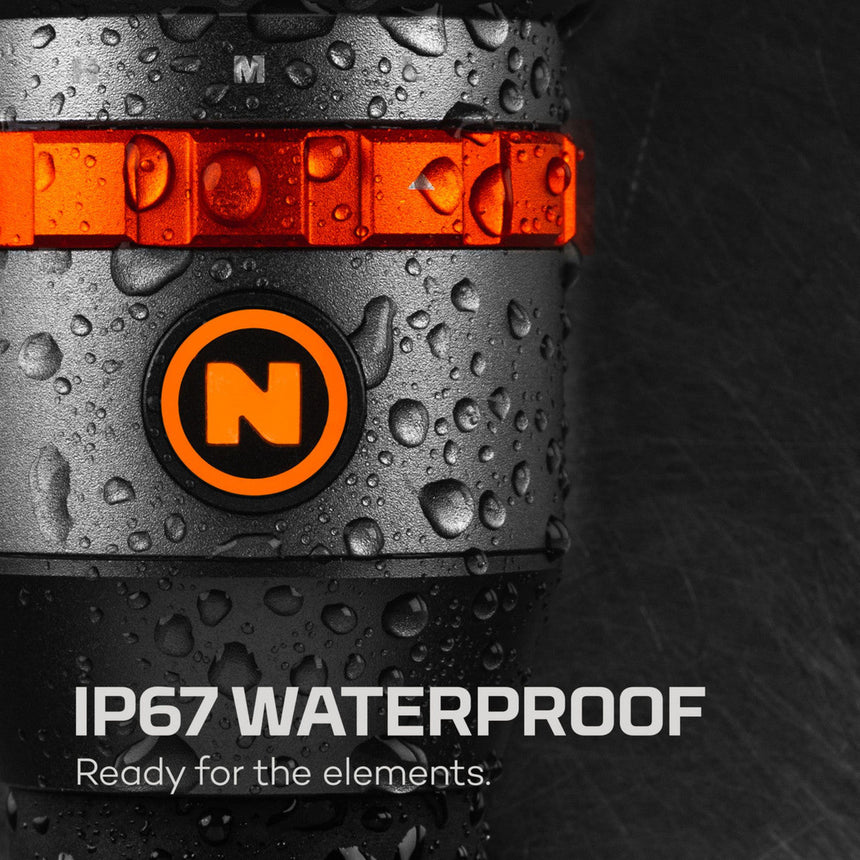 Waterproof electronic device or camera with an orange stripe and ’N’ logo, displaying water droplets on its surface.