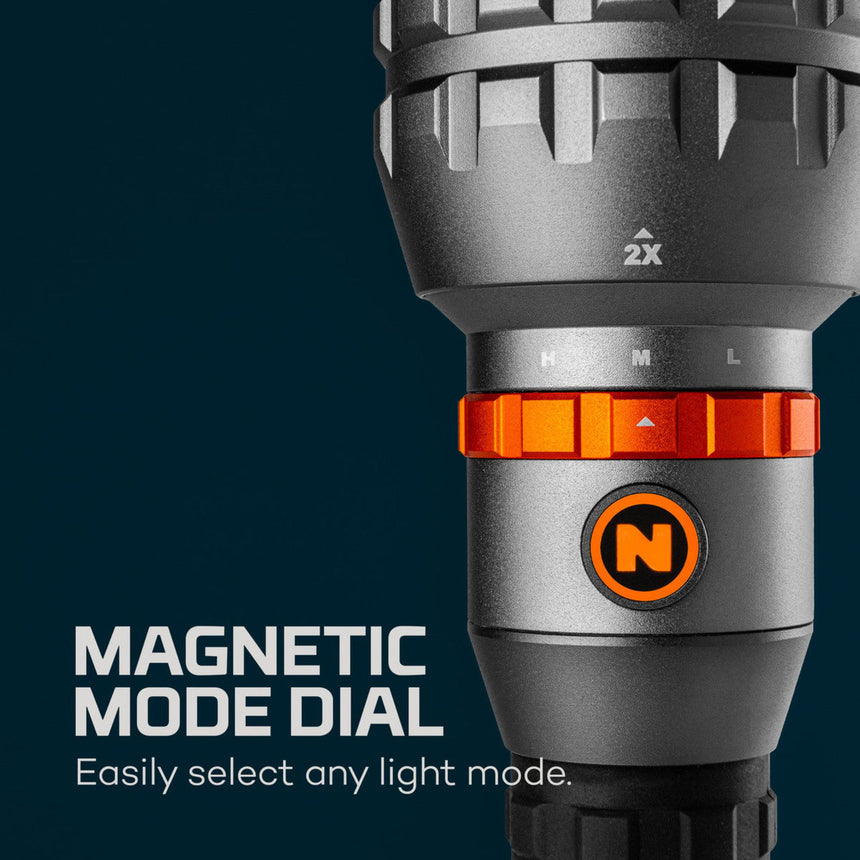 Flashlight with a magnetic mode dial and orange accents.