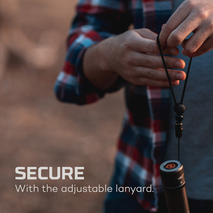 Adjustable lanyard attached to a cylindrical object, likely a water bottle or thermos.