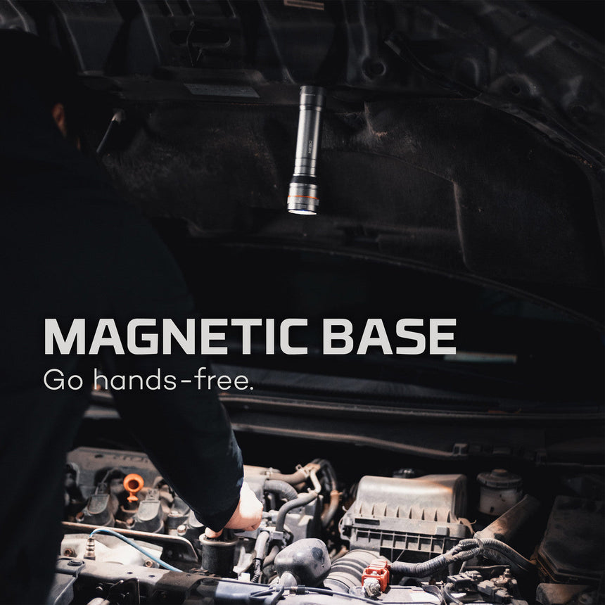 Magnetic tool holder suspended above an engine compartment.