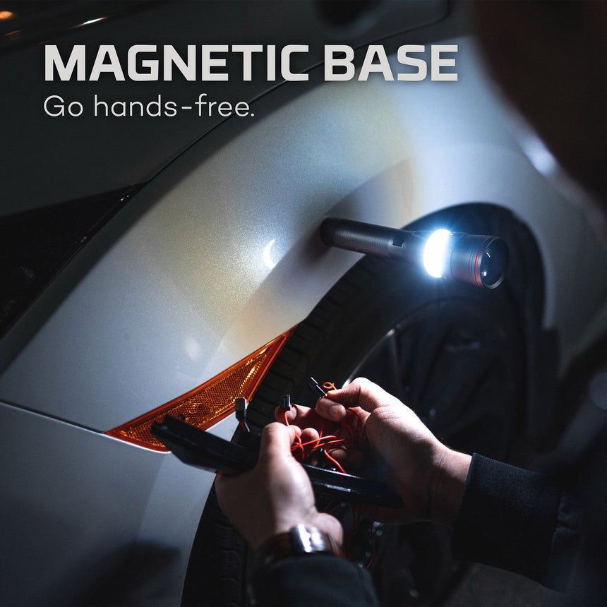 Magnetic base light with a flexible arm illuminating a person’s hands working on a task.