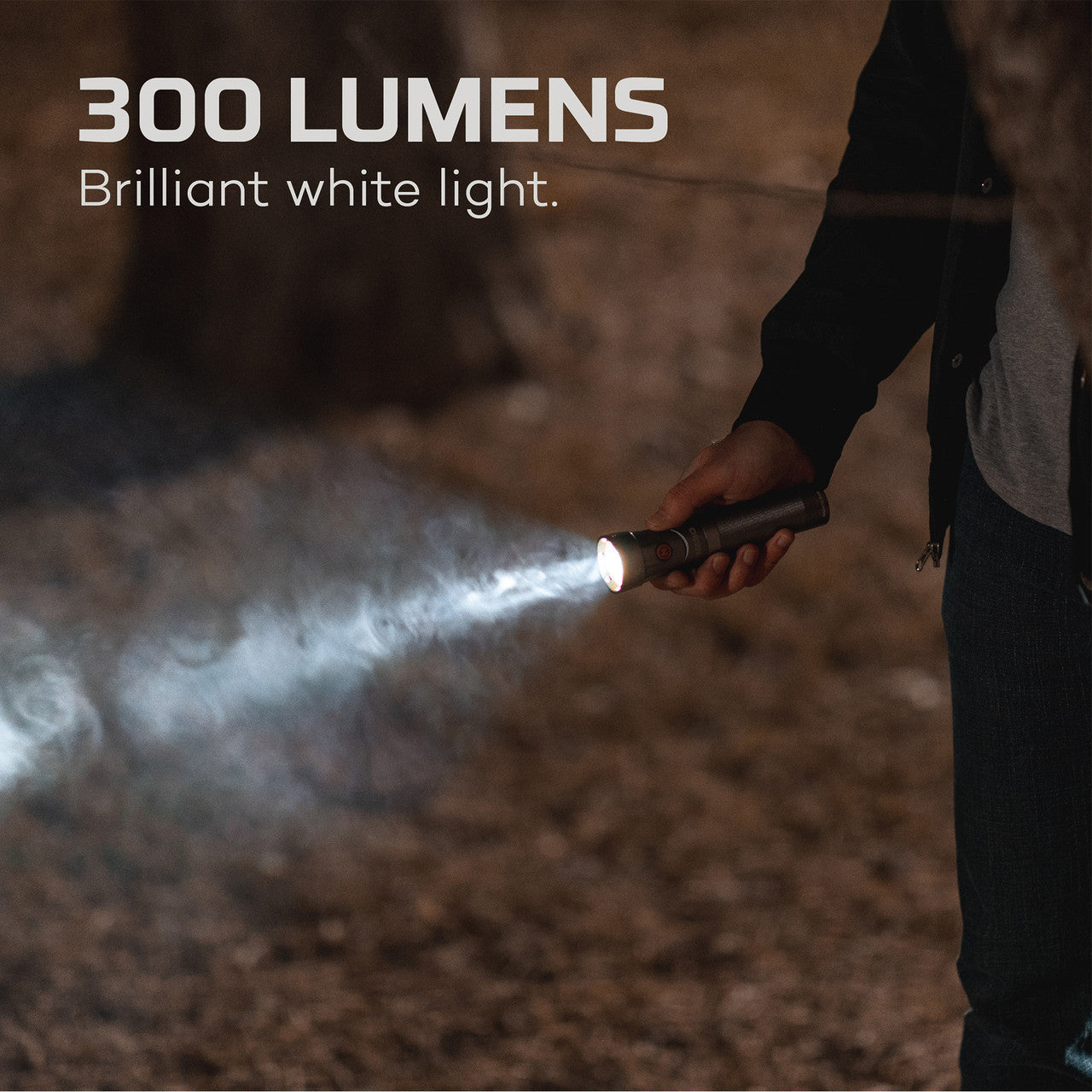 Flashlight emitting a bright beam of light in a dark environment.