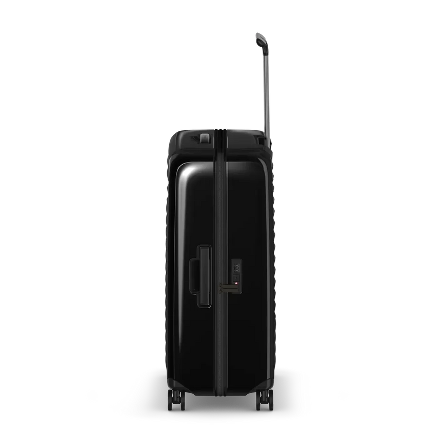 Black hardshell rolling suitcase with an extendable handle.