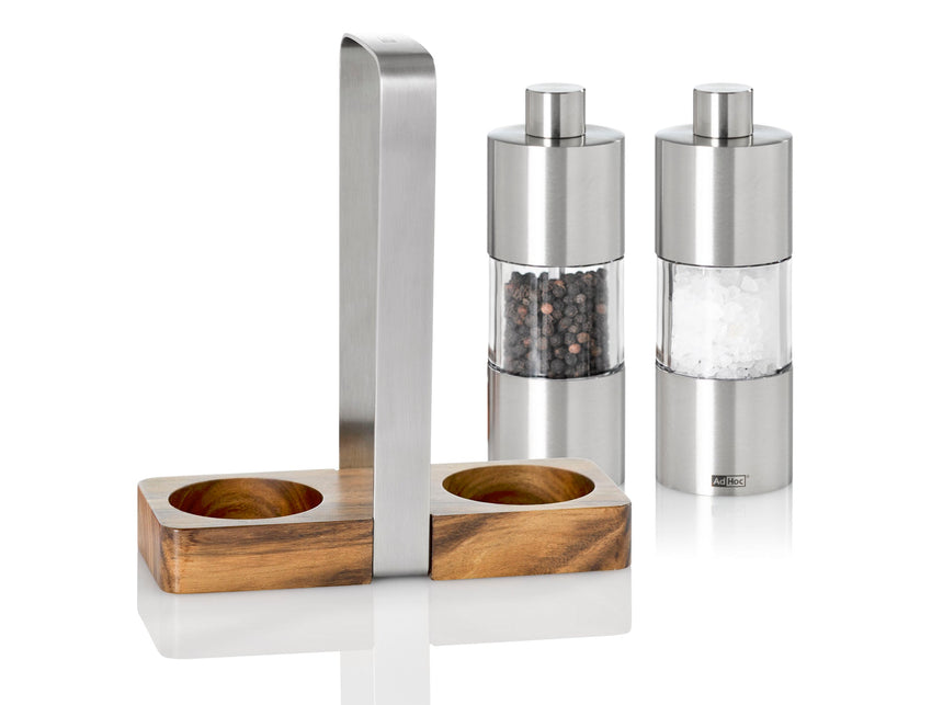 Salt and pepper grinder set with a wooden and metal stand.