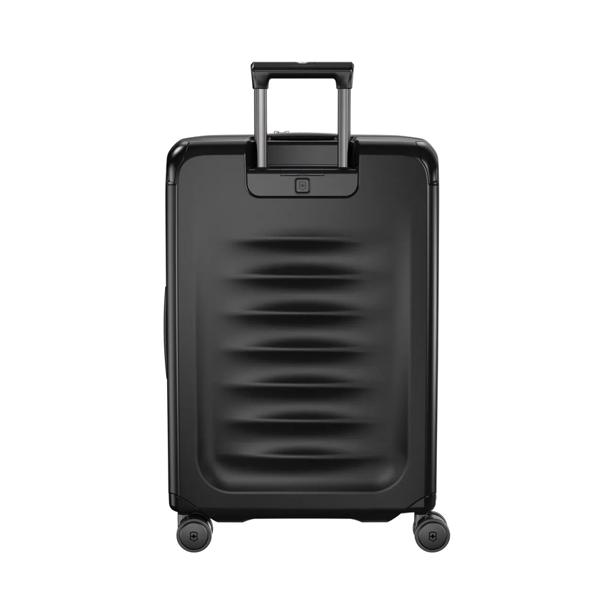 Black hardshell rolling suitcase with horizontal ridges and a retractable handle.
