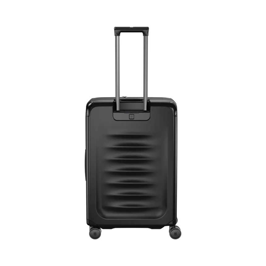 Black hardshell rolling suitcase with a retractable handle and horizontal ridges on the front.