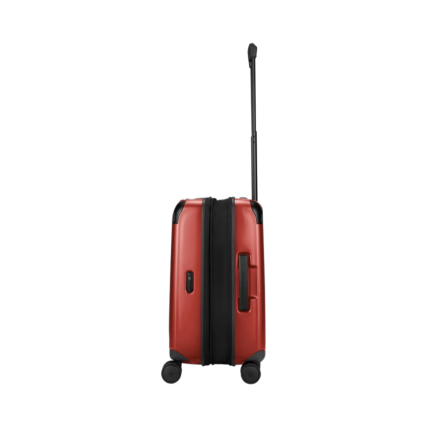 Red hardshell suitcase with wheels and an extendable handle.