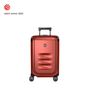 Red metallic hardshell carry-on suitcase with wheels and a retractable handle.