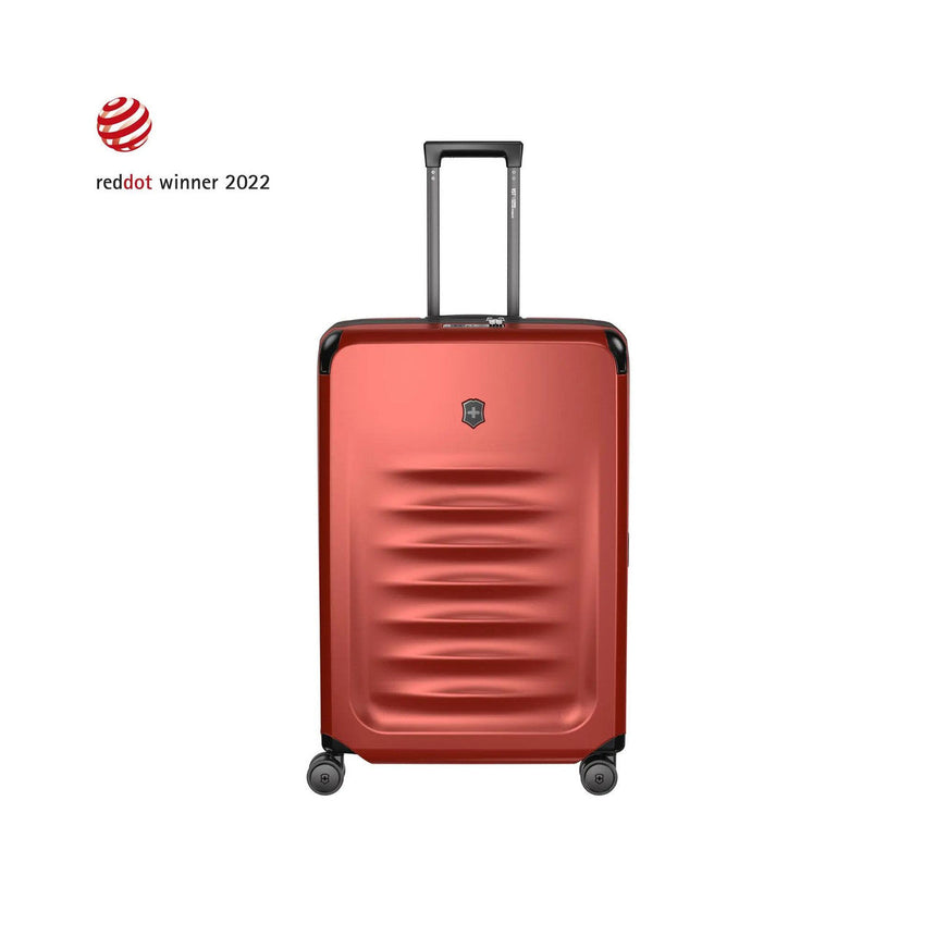Red hardshell rolling suitcase with horizontal ridges and an extendable handle.