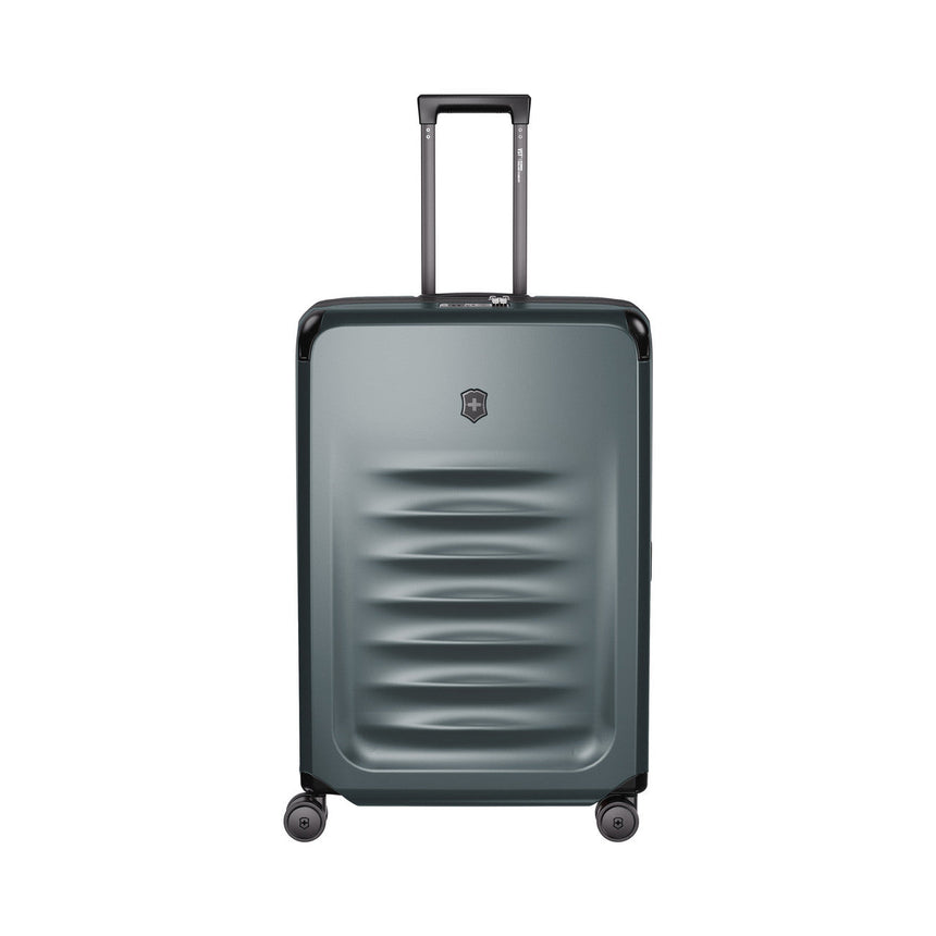 Gray hardshell rolling suitcase with horizontal ridges on the front.