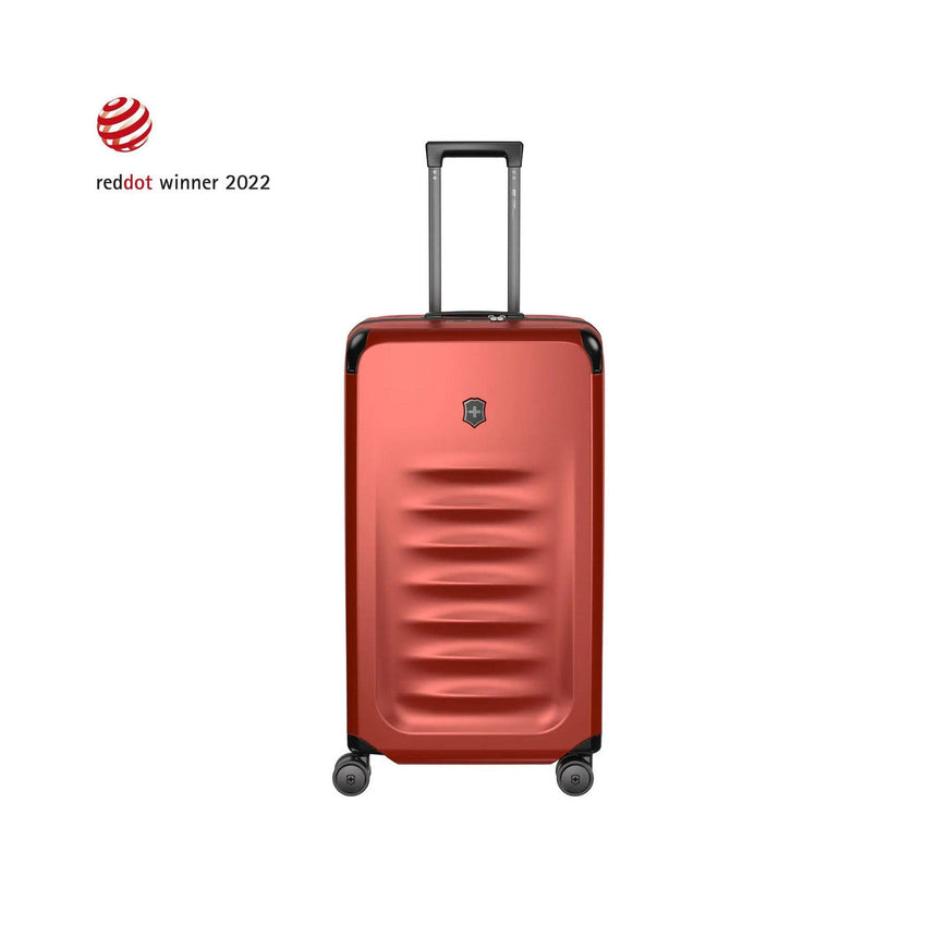 Red hardshell rolling suitcase with horizontal ridges on the front.